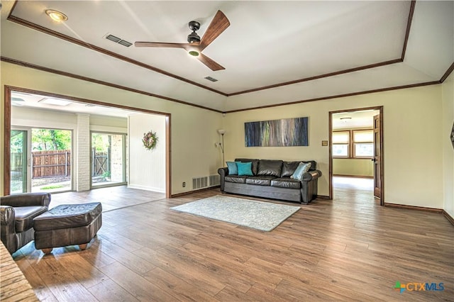 2702 Olympia Dr, Temple, TX 76502 - living room with ornamental molding, hardwood / wood-style flooring, a ceiling fan, and a tray ceiling