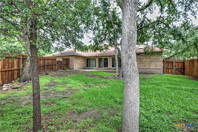 2702 Olympia Dr, Temple, TX 76502 - back of house featuring brick siding and a fenced backyard