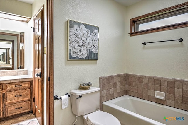 2702 Olympia Dr, Temple, TX 76502 - full bathroom with a bath, vanity, tile patterned floors, and a textured wall