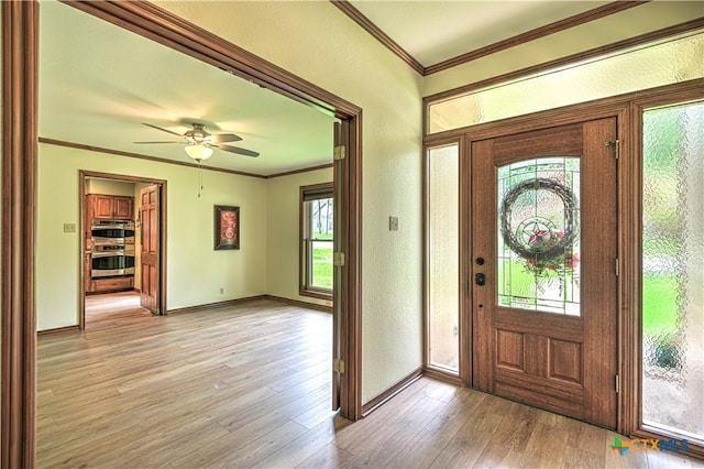 2702 Olympia Dr, Temple, TX 76502 - entrance foyer featuring crown molding, light wood finished floors, and a ceiling fan
