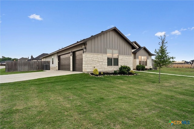 2716 Prairie Chapel Ct, Temple, TX 76502 - view of front of home with board and batten siding, an attached garage, driveway, stone siding, and central air condition unit