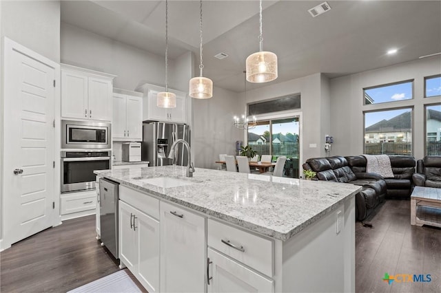 2716 Prairie Chapel Ct, Temple, TX 76502 - kitchen featuring stainless steel appliances, a sink, dark wood-style floors, and white cabinets