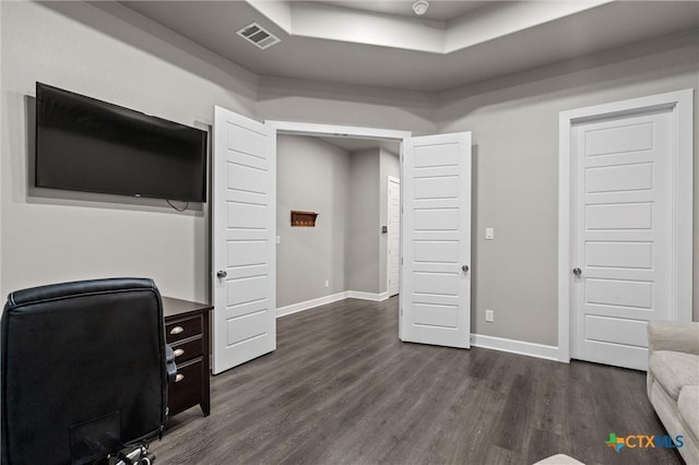2716 Prairie Chapel Ct, Temple, TX 76502 - office area featuring dark wood-style flooring, a raised ceiling, and baseboards