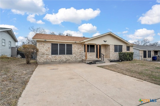 single story home with stone siding