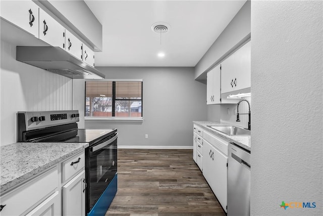 kitchen featuring baseboards, dark wood-type flooring, stainless steel appliances, white cabinetry, and a sink