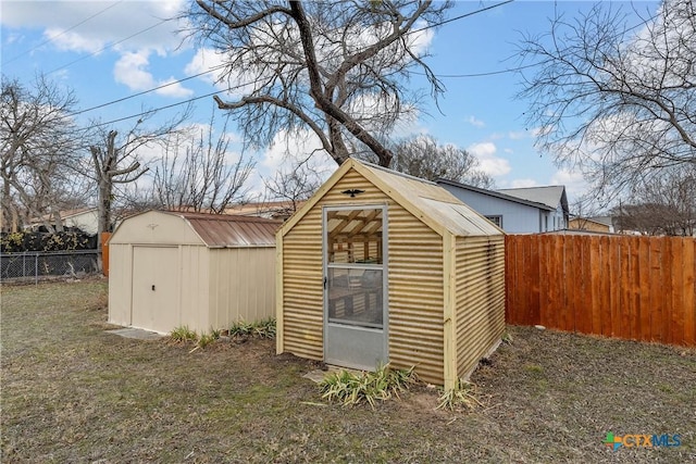 view of shed featuring a fenced backyard