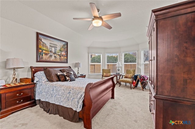 bedroom with ceiling fan and light carpet