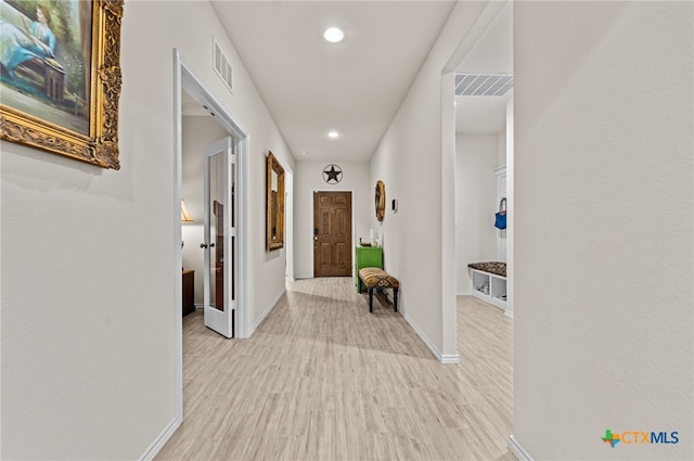 hallway featuring light wood-type flooring