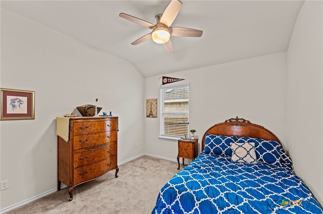 bedroom with light carpet, vaulted ceiling, and ceiling fan