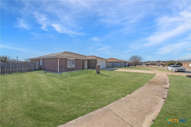 exterior space featuring a garage and a front yard