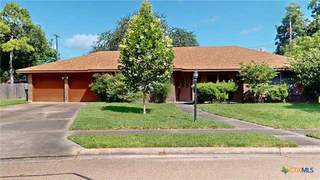 107 Hampton Ct, Victoria, TX 77904 - ranch-style house with driveway, brick siding, an attached garage, and roof with shingles