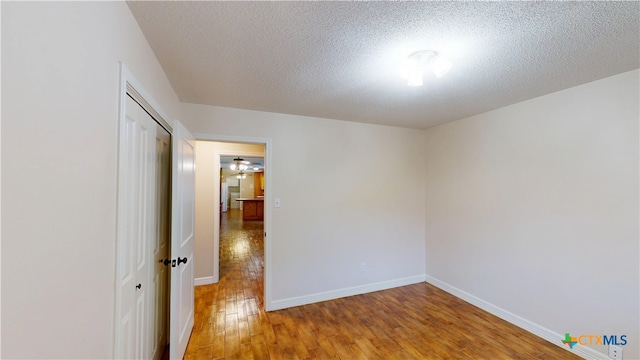 107 Hampton Ct, Victoria, TX 77904 - empty room with hardwood / wood-style floors and a textured ceiling