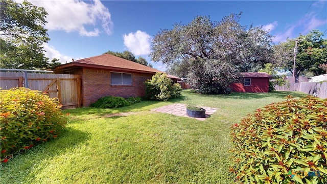 107 Hampton Ct, Victoria, TX 77904 - fenced backyard featuring an outdoor structure