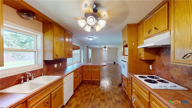 107 Hampton Ct, Victoria, TX 77904 - kitchen with white appliances, a ceiling fan, under cabinet range hood, tile countertops, and decorative backsplash