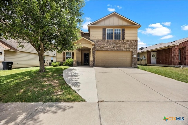 306 W Gemini Ln, Killeen, TX 76542 - view of front of home featuring board and batten siding, a garage, a front lawn, driveway, and brick siding