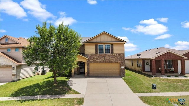306 W Gemini Ln, Killeen, TX 76542 - view of front facade with an attached garage, concrete driveway, board and batten siding, and a front lawn