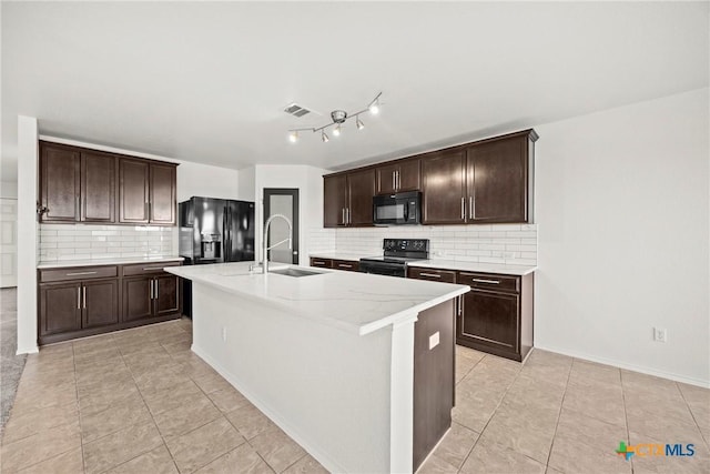 306 W Gemini Ln, Killeen, TX 76542 - kitchen featuring black appliances, decorative backsplash, light tile patterned floors, and dark brown cabinetry