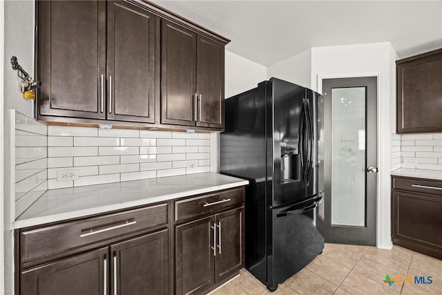 306 W Gemini Ln, Killeen, TX 76542 - kitchen with black fridge with ice dispenser, light countertops, dark brown cabinets, and decorative backsplash
