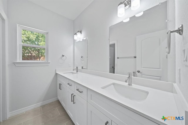 bathroom with vanity and tile patterned floors