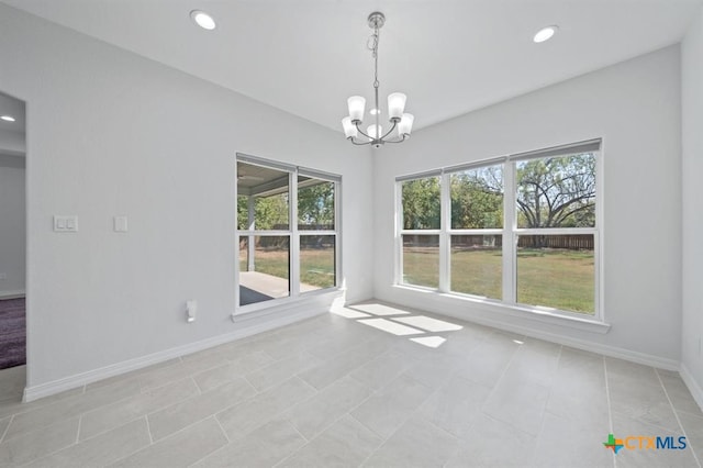 unfurnished dining area featuring light tile patterned floors and a chandelier