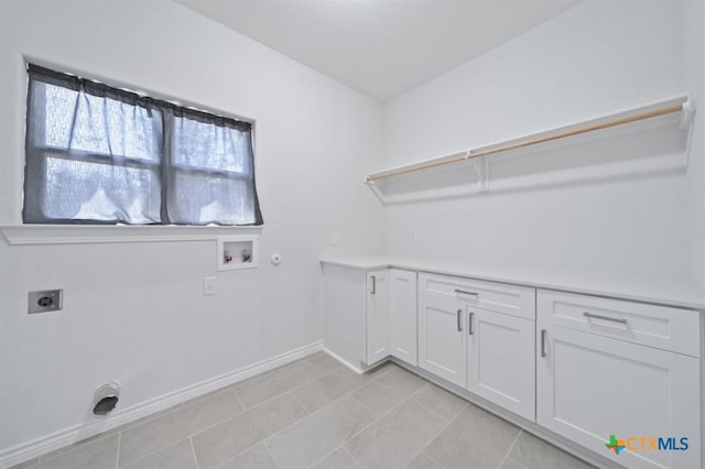 laundry area with hookup for an electric dryer, hookup for a gas dryer, cabinets, and washer hookup