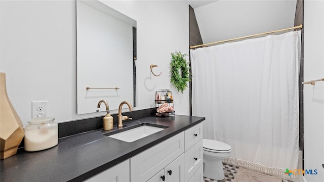 bathroom featuring a shower with curtain, vanity, and toilet