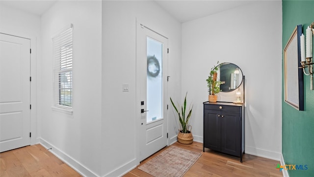 entryway with light hardwood / wood-style floors