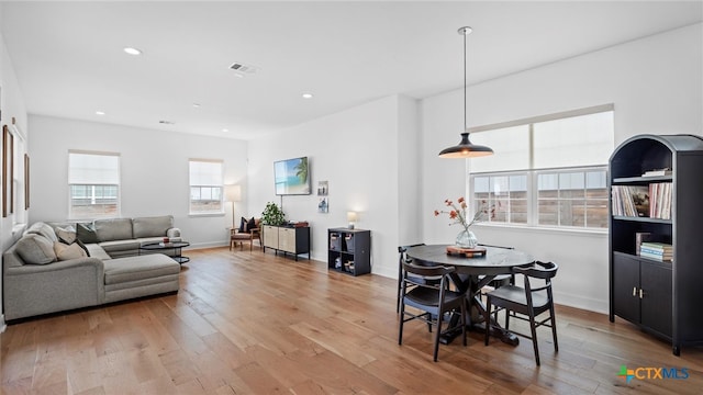 dining space featuring light wood-type flooring