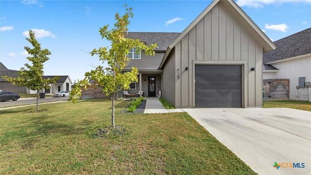 view of front of house featuring a garage and a front yard