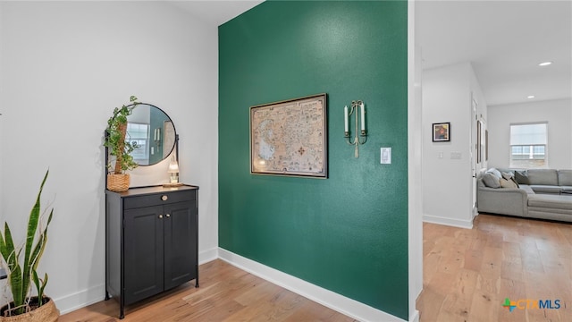 hall with light hardwood / wood-style flooring