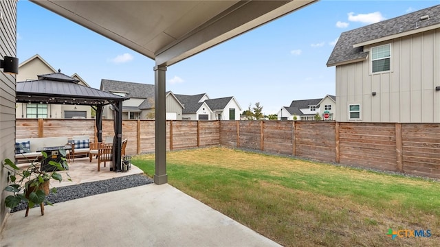 view of yard with outdoor lounge area, a gazebo, and a patio