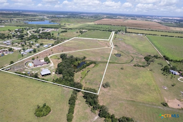 birds eye view of property featuring a rural view and a water view