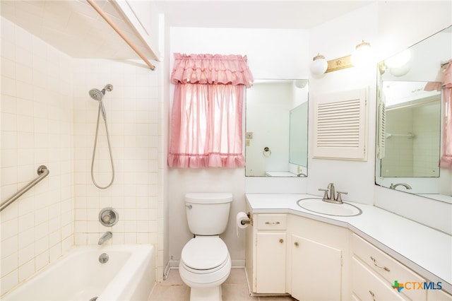 full bathroom with tile patterned floors, vanity, toilet, and tiled shower / bath