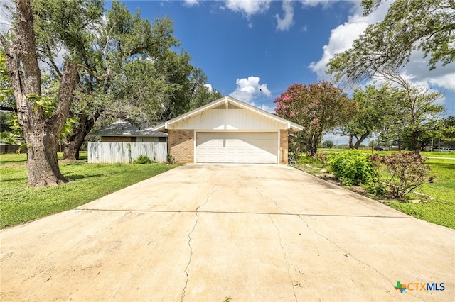 view of front facade featuring a front yard and a garage