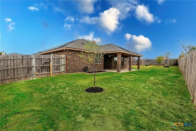 view of yard featuring a fenced backyard and a patio area