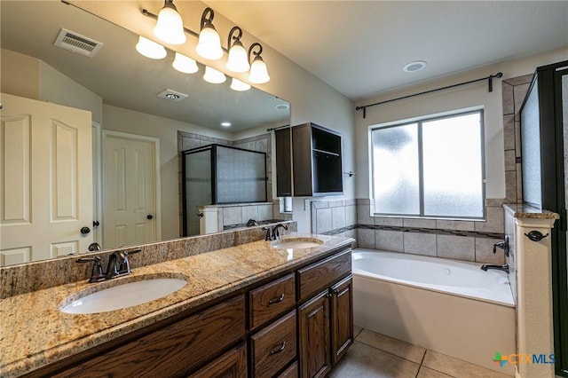 full bath with a shower stall, visible vents, tile patterned flooring, and a sink