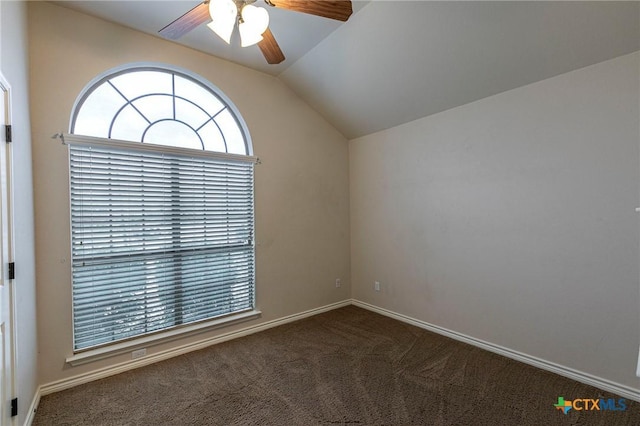 empty room with a ceiling fan, carpet floors, baseboards, and lofted ceiling