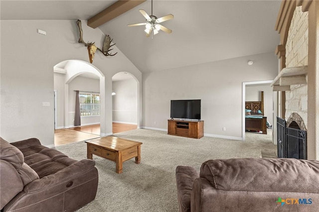 820 Thomas St, Copperas Cove, TX 76522 - living room featuring arched walkways, ceiling fan, high vaulted ceiling, a fireplace, and carpet