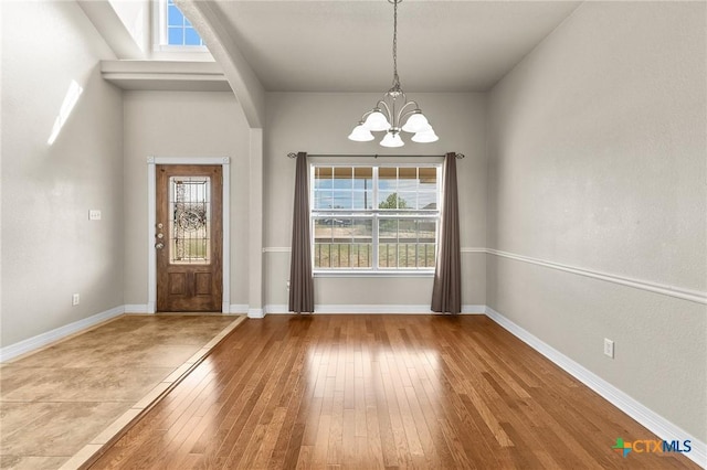 820 Thomas St, Copperas Cove, TX 76522 - foyer with a chandelier, hardwood / wood-style floors, and baseboards