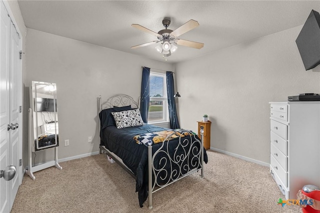 820 Thomas St, Copperas Cove, TX 76522 - bedroom with light colored carpet, baseboards, and a ceiling fan