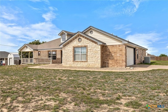 820 Thomas St, Copperas Cove, TX 76522 - ranch-style home with concrete driveway, central AC, a storage shed, an attached garage, and a porch