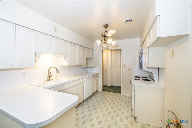 kitchen featuring an inviting chandelier, white appliances, light countertops, a peninsula, and visible vents