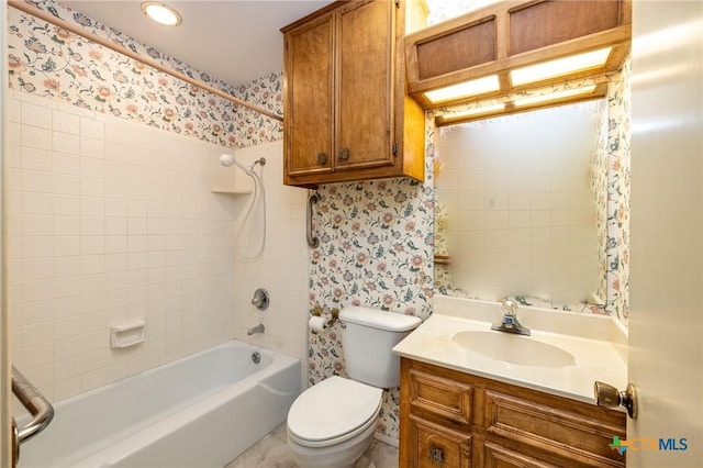 bathroom with vanity, shower / bath combo, wallpapered walls, and toilet