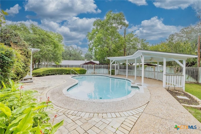 view of pool with a patio, a fenced in pool, and a fenced backyard