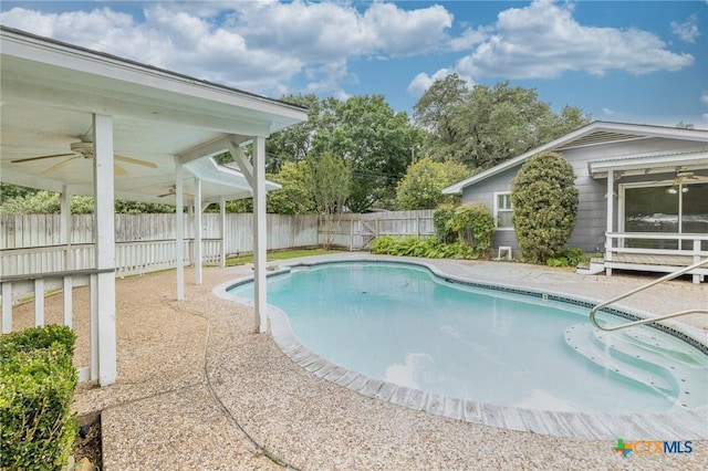 view of pool with ceiling fan, a fenced in pool, and a fenced backyard