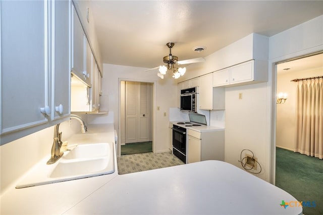 kitchen featuring ceiling fan, wall oven, light countertops, white cabinets, and black range with electric cooktop