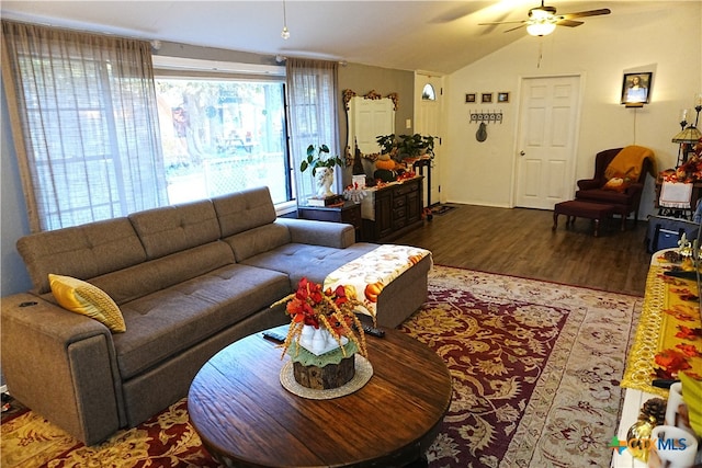 living room with vaulted ceiling, ceiling fan, and hardwood / wood-style flooring