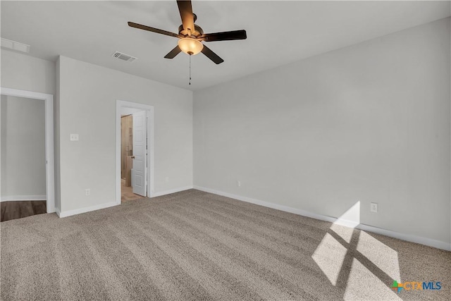 unfurnished bedroom with ceiling fan and light colored carpet