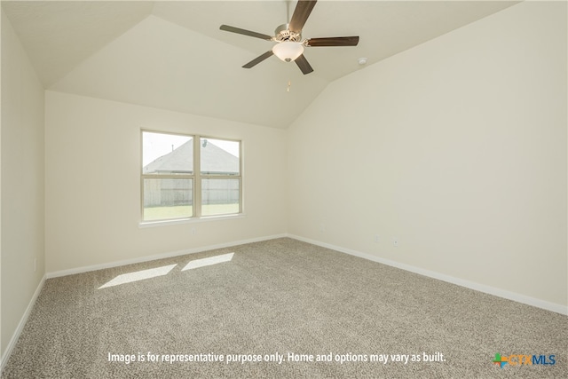 carpeted empty room featuring ceiling fan and lofted ceiling