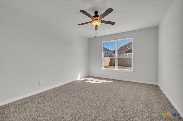 unfurnished room with carpet floors and ceiling fan